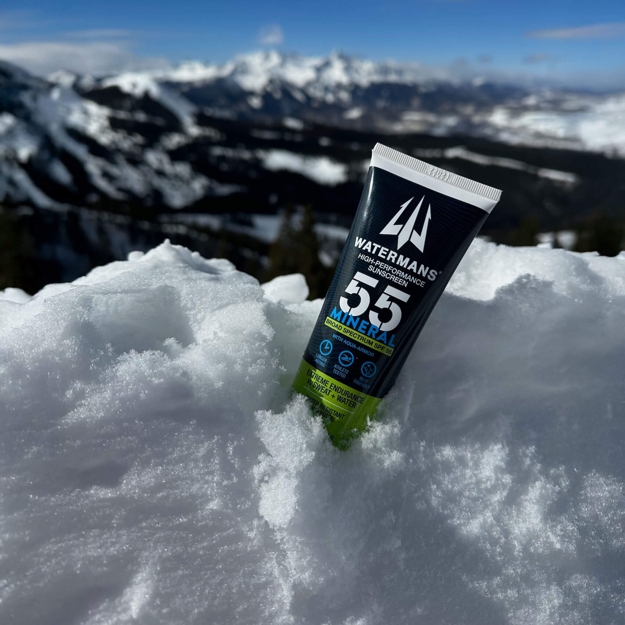 Watermans Mineral SPF 55 sunscreen tube held outdoors in natural light